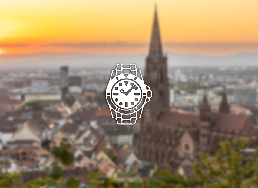 Freiburg im Breisgau mit Blick auf das Münster bei Sonnenuntergang – Symbolfoto für Rolex verkaufen und Ankauf in Freiburg