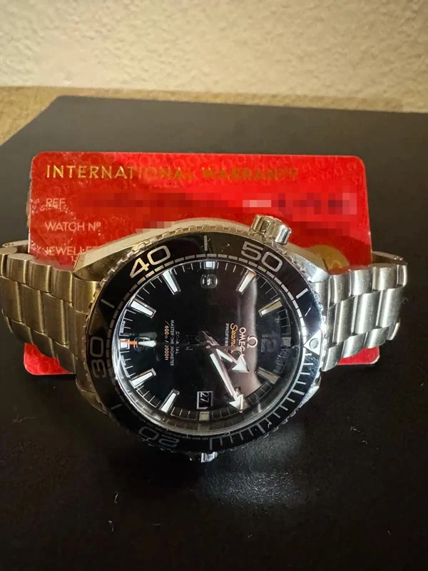 Omega Seamaster mit Garantiekarte und Edelstahlarmband für Omega Ankauf in Hamburg