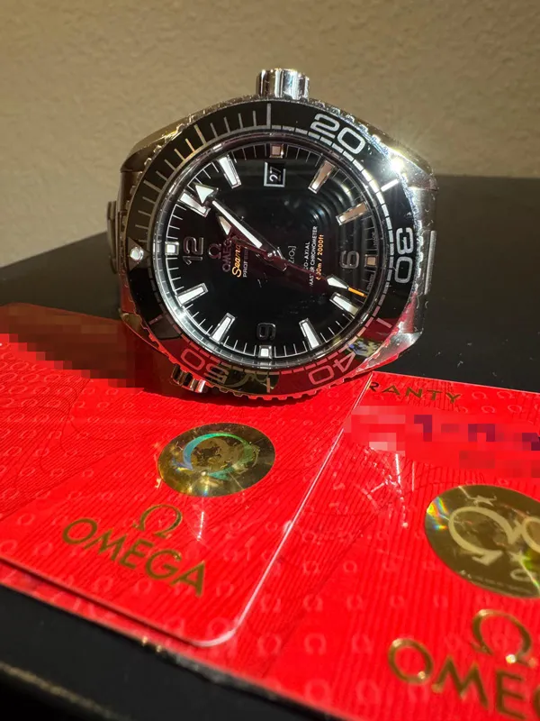 Omega Seamaster mit Garantiekarten und Originalunterlagen für Omega Ankauf in Hamburg