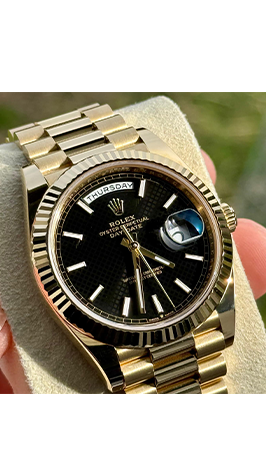 Rolex Day Date Gold mit schwarzem Zifferblatt beim Rolex Ankauf in Hamburg